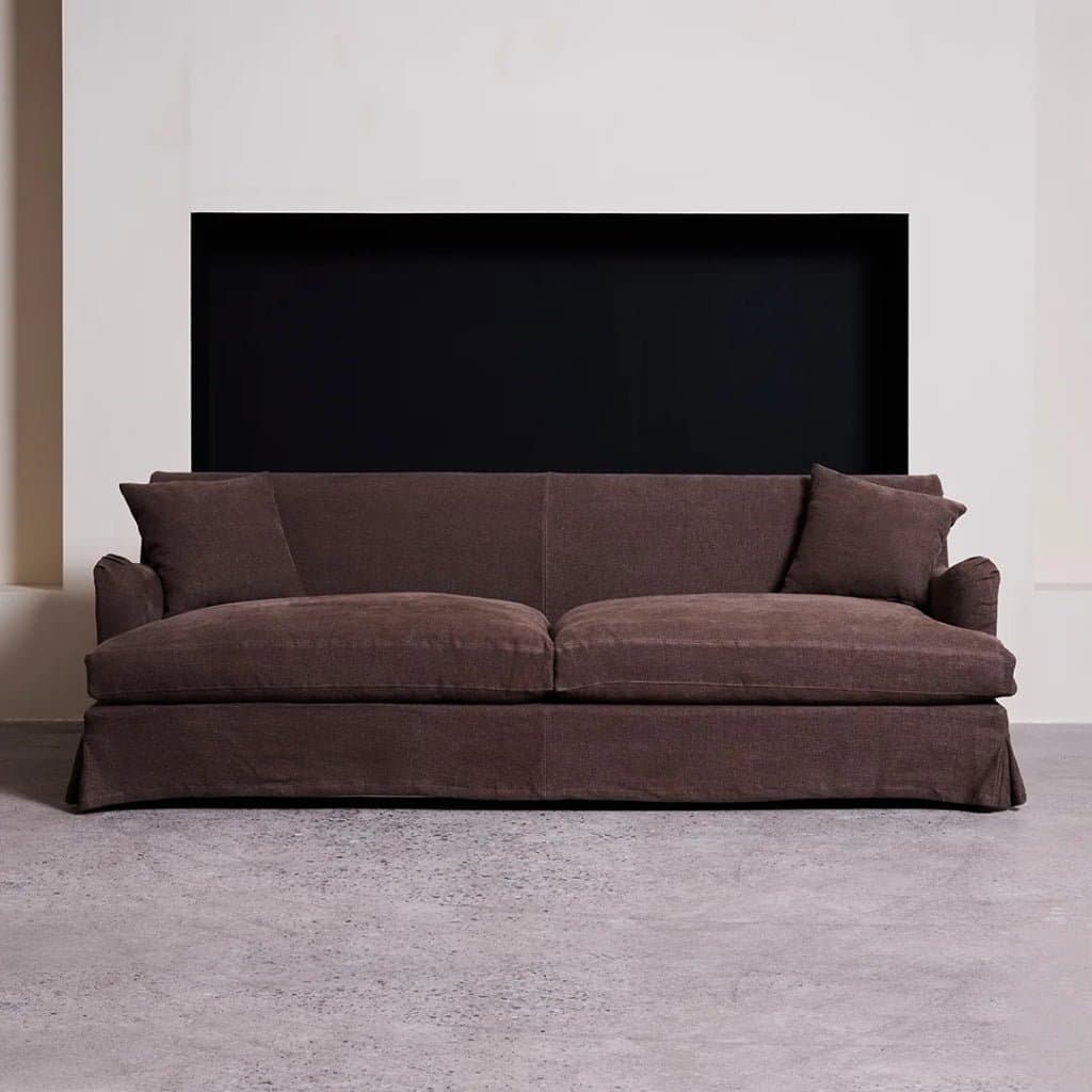 Master upholsterer sewing linen slipcovers in Foshan workshop